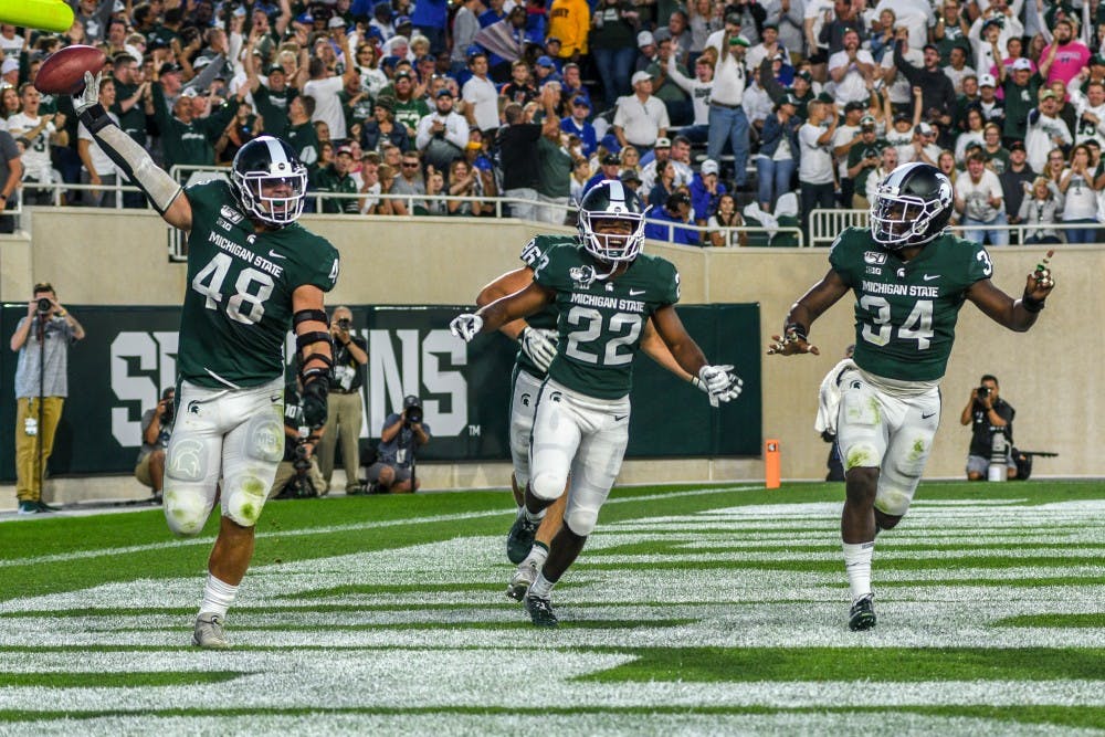<p>The Spartans celebrate during the game against Tulsa on Aug. 30, 2019 at Spartan Stadium. The Spartans defeated the Golden Hurricane, 28-7.</p>