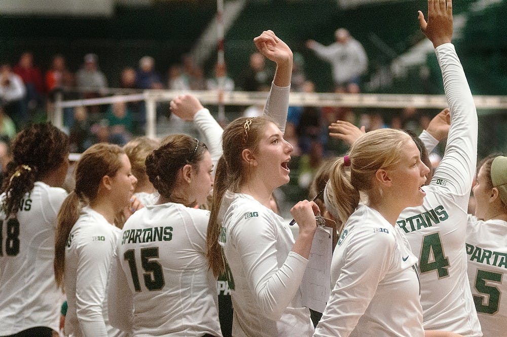 	<p>The women&#8217;s volleyball team cheers after a timeout is called by Illinois on Saturday Oct. 13, 2012 at Jenison Field House. Katie Stiefel/ State News</p>