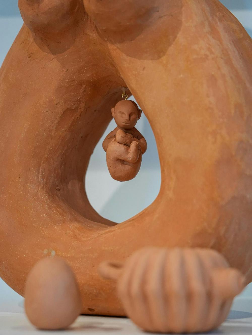 <p>A small, baby-like ceramic centerpiece is suspended in the middle of a larger statue in the MSU Union Art Gallery in East Lansing, Mich., on Tuesday, Sept. 8, 2026.</p>