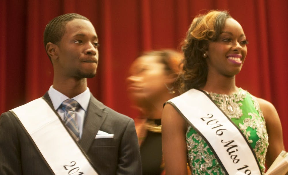 Applied engineering and science junior Malik Hall, left and supply chain management freshman Talaya Bates pose for a photo during the "Mr and Mrs Black MSU Pageant," at the Kellogg Center Auditorium on April 2, 2016. Hall and Bates were the runners up