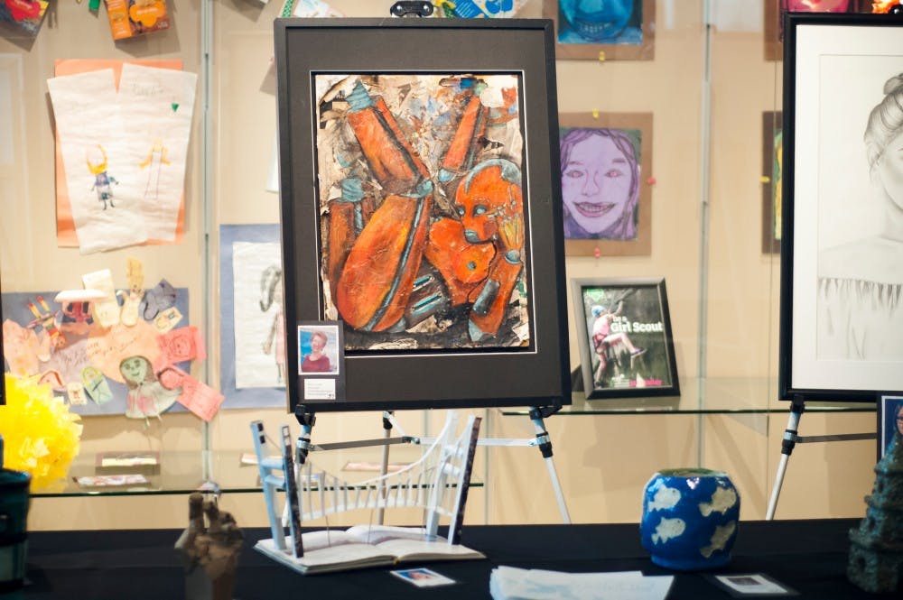 A work of art by Roslin Opolka titled "Rusty the Riveter" is pictured on Feb. 1, 2017 at Michigan State Federal Credit Union at 3777 West Road in East Lansing. This exhibit features art pieces from 19 area high schools that will be voted for online, and at the exhibit for four different awards.