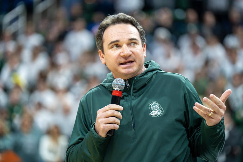 <p>Freshly minted Head Football Coach Jonathan Smith speaks at the Jack Breslin Student Events Center during a timeout of Michigan State's bout against Georgia Southern on Nov. 28, 2023. This was Coach Smith's first public appearance as Head Coach following his hire and press conference earlier that day.</p>