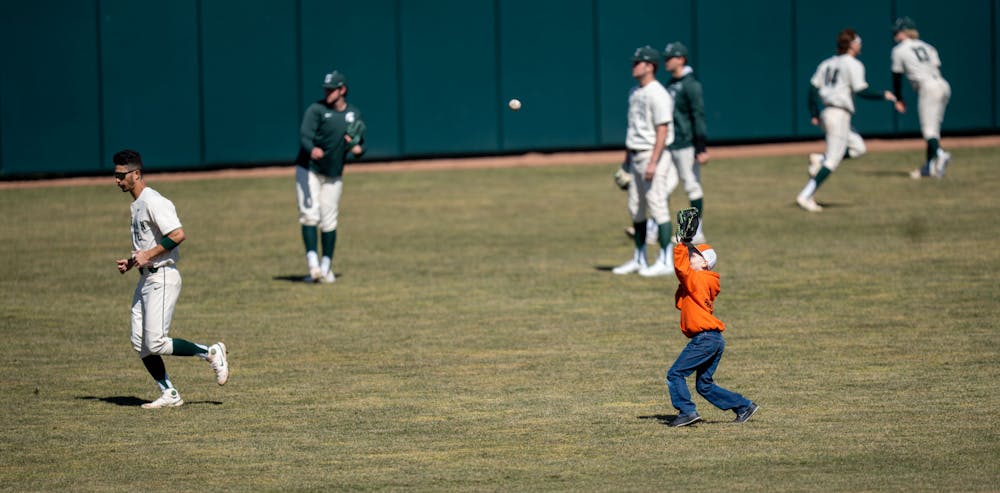 It's not just the players warming up on March 20, 2022. A little boy also joins in on the fun. MSU would win the double header 1-0, 6-5 against Houston Baptist. 