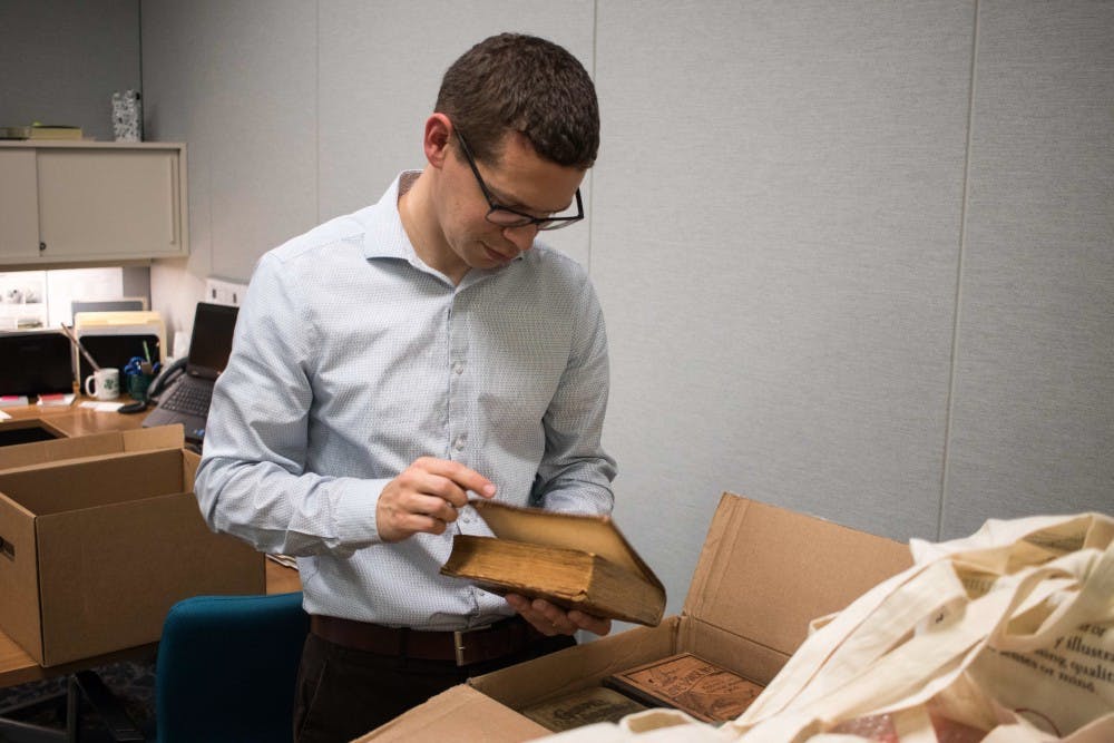 <p>Pictured is rare books librarian Patrick Olson on Oct. 6, 2017, in the special collections department of the Main Library.</p>