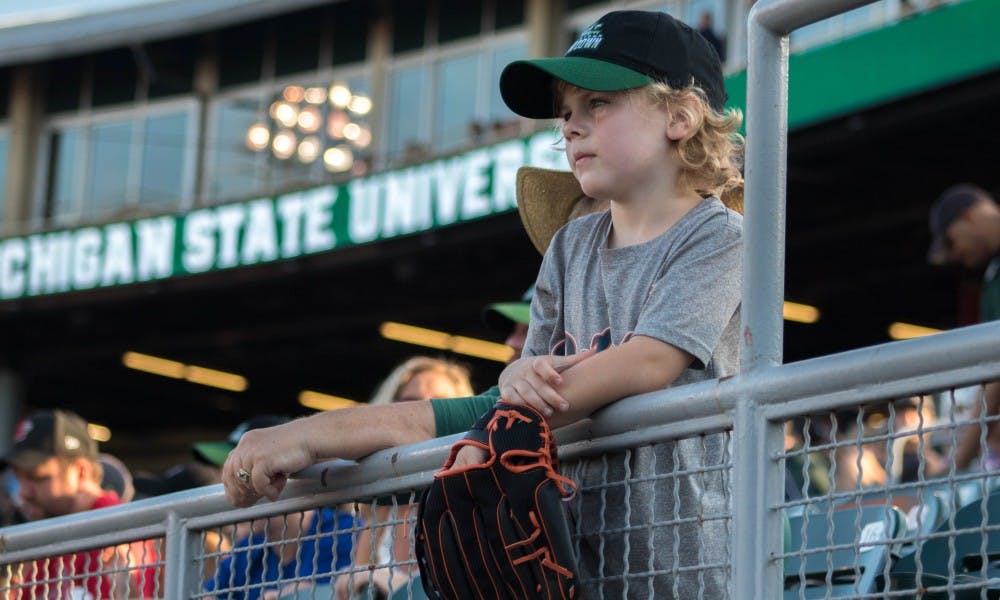 Leslie, Michigan resident Spencer Malkowski, 6, watches the game at Cooley Law School Stadium on Sep. 4, 2018. Malkowski attended the game with his grandma, a season ticket holder. The Lugnuts defeated the Spartans 6-4.