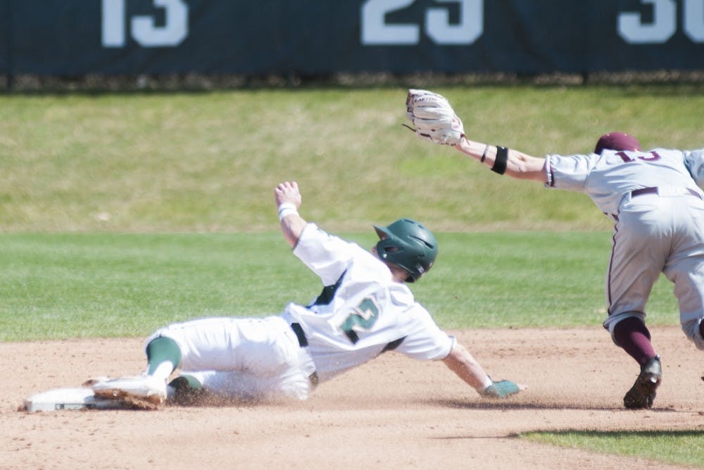 Sophomore infielder Marty Bechina (2) safely slides on second base during the game against the University of Minnesota on April 1, 2017 at McLane Stadium at Kobs Field. The Spartans defeated the Goldy Gophers, x-x. 