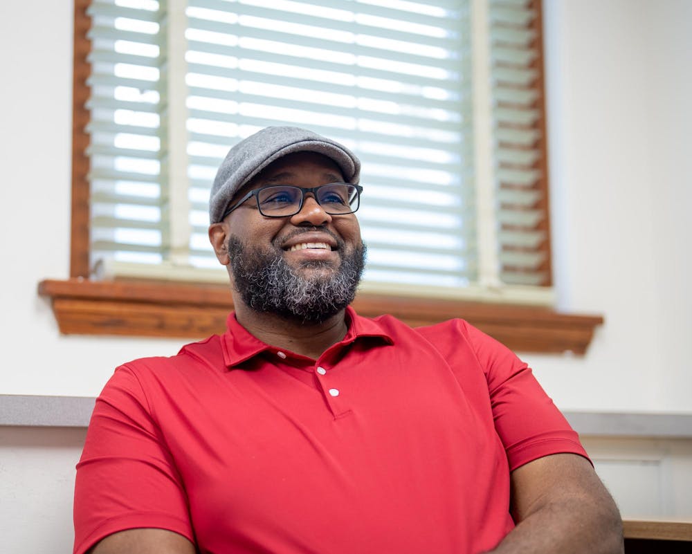 Michigan State professor Dr. Glenn Chambers sits in his office at Old Horticulture Hall in East Lansing, Michigan on May 22, 2025. Chambers is the MSU Interim Dean of the Honors College and Interim Dean of the Residential College in the Arts and Humanities, as well as a member of the "Groove Doctors 3," a band comprised of MSU professors. Following in the footsteps of his musical family, Chambers is a multi-instrumentalist turned history professor, using historical knowledge to influence his playing. 