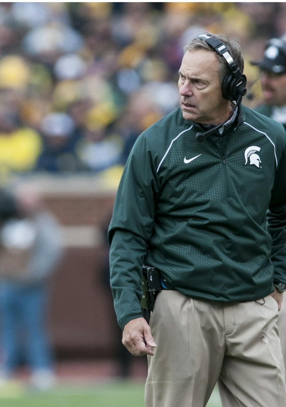 Head coach Mark Dantonio looks onto the field on Oct. 17, 2015, during the second quarter of the game against Michigan at Michigan Stadium in Ann Arbor. The Spartans defeated the Wolverines, 27-23. 