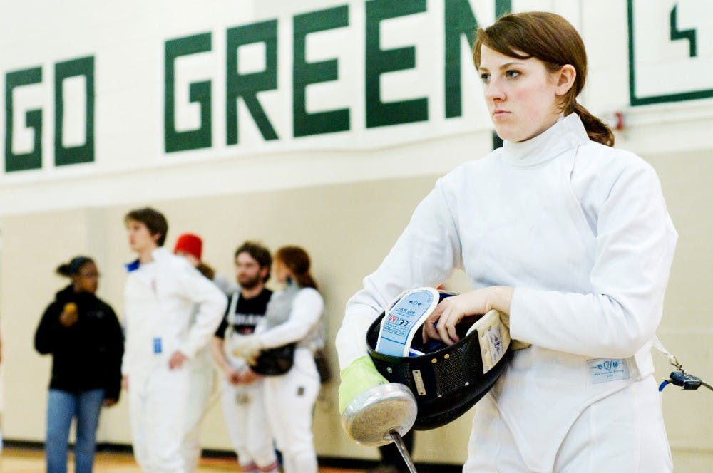 Apparel and textile design senior Erin Vonkronenberger prepares for another round of fencing Sunday afternoon inside IM West. The MSU Fencing Club hosted the collegiate tournament, competing with athletes from University of Michigan, Oakland University, Case Western Reserve, and University of Indiana. Justin Wan/The State News