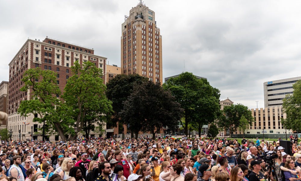<p>A record crowd gathers outside of the Michigan Capitol for the 2019 Michigan Pride Rally on June 15, 2019.</p>