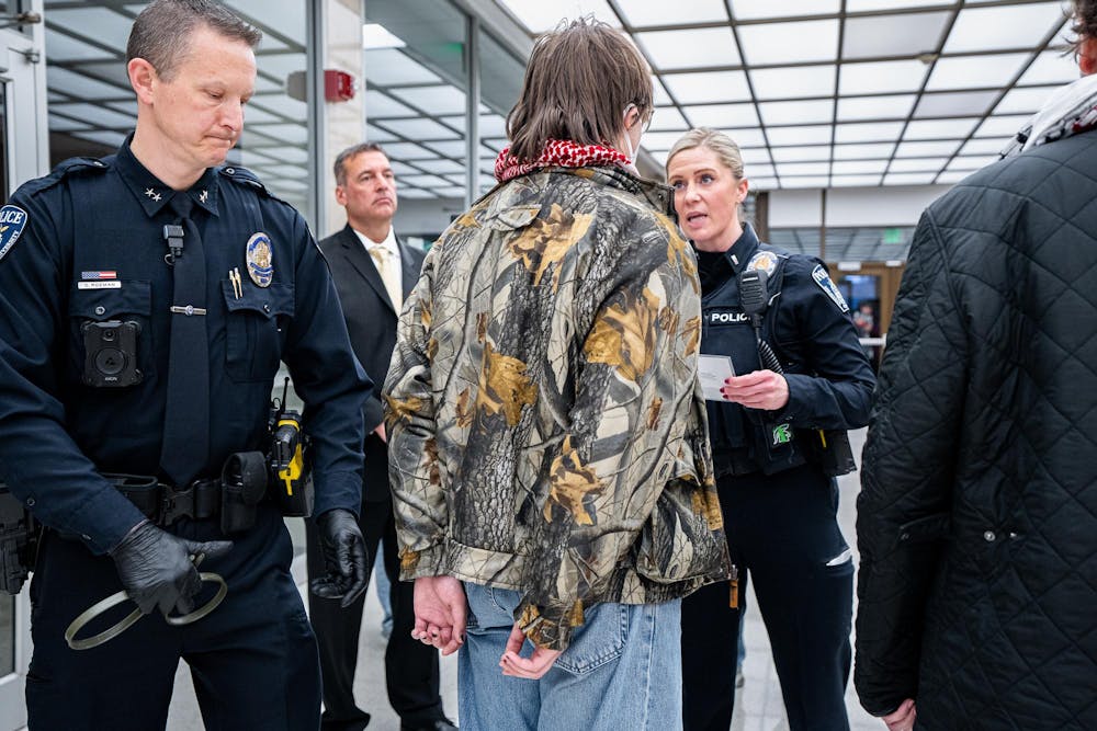 <p>Michigan State University Deputy Chief Chris Rozman arrests a protestor while Lieutenant Kimberly Parviainen reads their Miranda rights in the lobby of the Hannah Administration Building in East Lansing, Michigan on April 11, 2025. Members of MSU Sunrise and the Hurriya Coalition protested in the lobby, 19 protestors were arrested after multiple warnings from the police.</p>