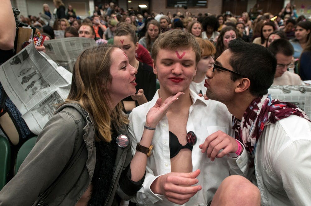 From left: astrophysics sophomore Bridget Dexter, video game design and development sophomore Eric Hussey, and biomedical engineering sophomore Josh Shah prepare for the Rocky Horror Picture Show showing on Nov. 4, 2016 at Wells Hall. The University Activities Board hosted a Rocky Horror Picture Show night with free admission to students. 