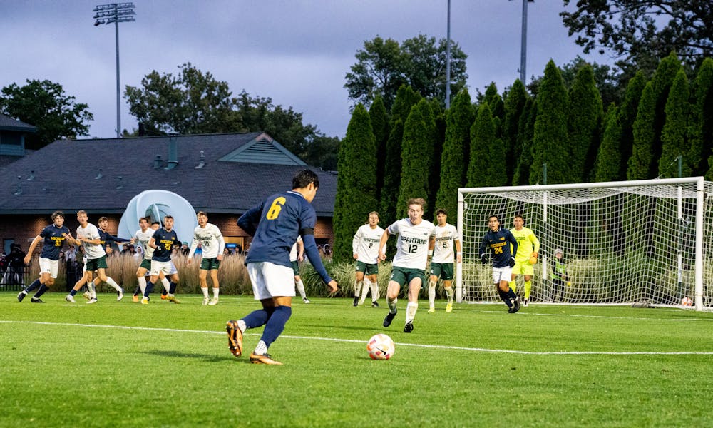 <p>University of Michigan junior midfielder Quin Rogers (6) is about to kick the ball at DeMartin Stadium on Sept. 27, 2022. Spartans defeated the Wolverines 2-0. </p>