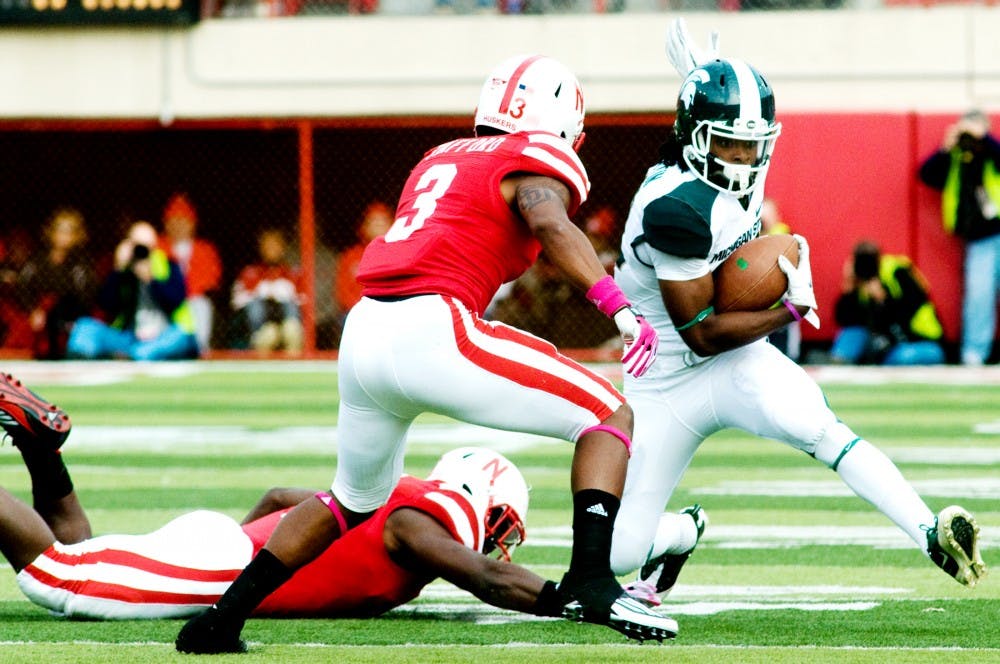 Senior wide receiver Keshawn Martin tries to side step safety Daimion Stafford.The Cornhuskers defeated the Spartans, 24-3, on Saturday afternoon at Memorial Stadium in Lincoln, Neb. Anthony Thibodeau/The State News