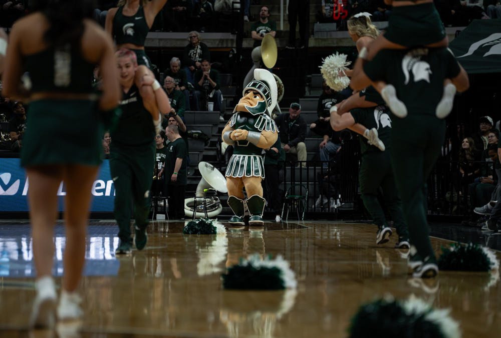 <p>Michigan State University’s Sparty stands on the court with cheerleaders, acknowledging fans at the Breslin Center in East Lansing, Michigan on Sunday, March 1, 2026.</p>