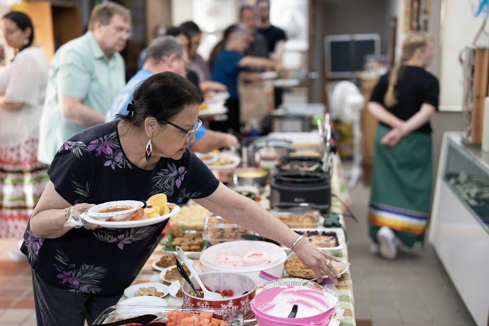 Visitors to the Nokomis Cultural Heritage Center in Okemos enjoy their potluck dinner on Michigan Indian Day on Sept. 22, 2023.