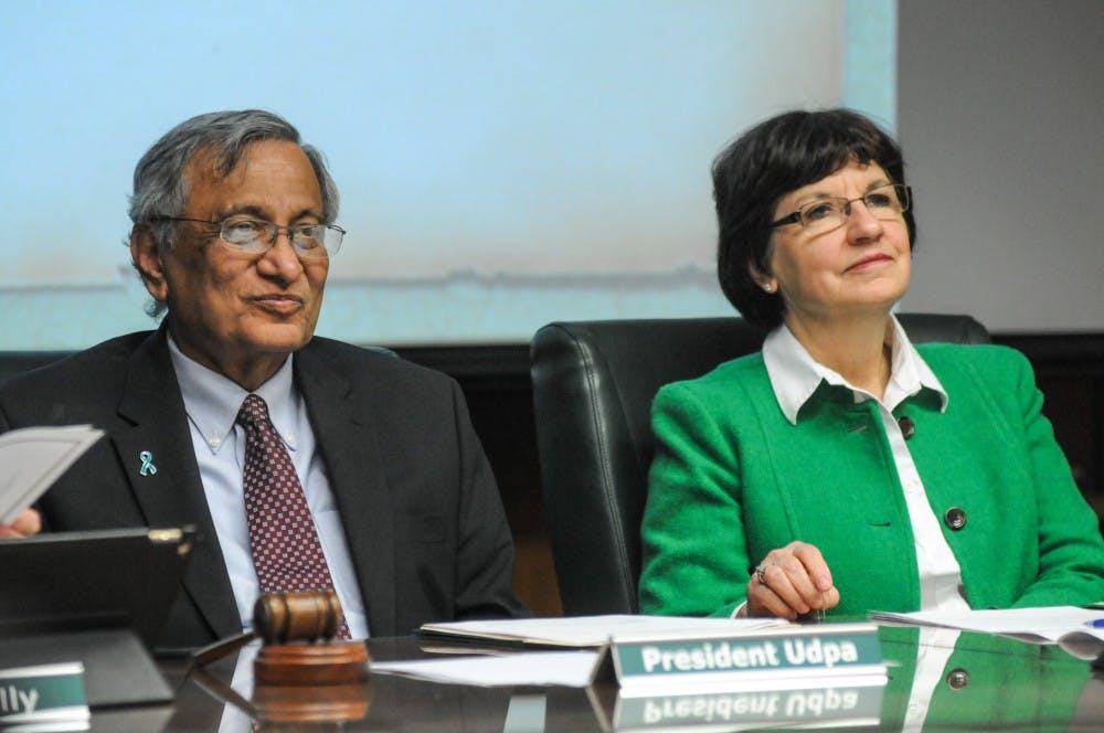 <p>Interim President Satish Udpa, left, and trustee Byrum, right, listen at the Board of Trustees meeting on April 12, 2019 at the Administration Building.</p>