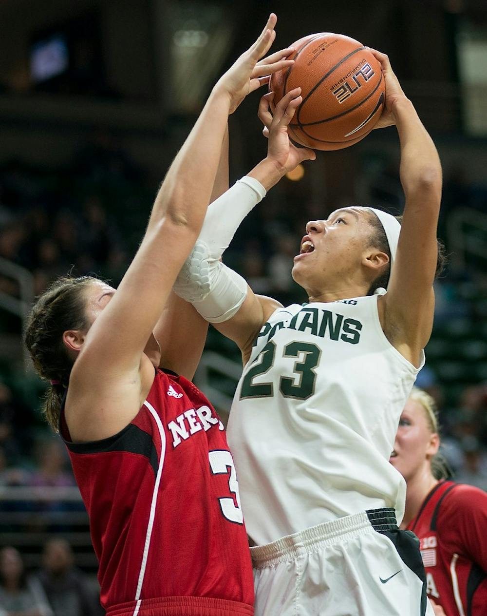 <p>Sophomore guard Aerial Powers attempts a point past Nebraska forward Hailie Sample Jan. 8, 2015, during the game against Nebraska at Breslin Center. The Spartans were defeated by the Huskers, 71-67. Erin Hampton/The State News</p>