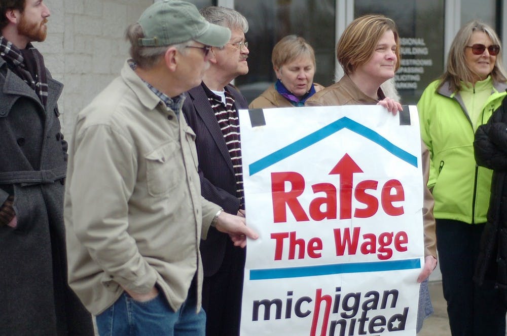 <p>Protesters rally outside of U.S. Rep. Mike Rogers', R-Mich., office on April 1, 2014, in Lansing. Similar rallies occurred across the country to protest congresspeople who voted against raising the minimum wage. Emily Jenks/The State News</p>