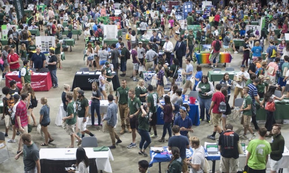 Students walk the floor of the Breslin Center during Sparticipation on Sept. 18, 2016. The event was held to help students and clubs connect.