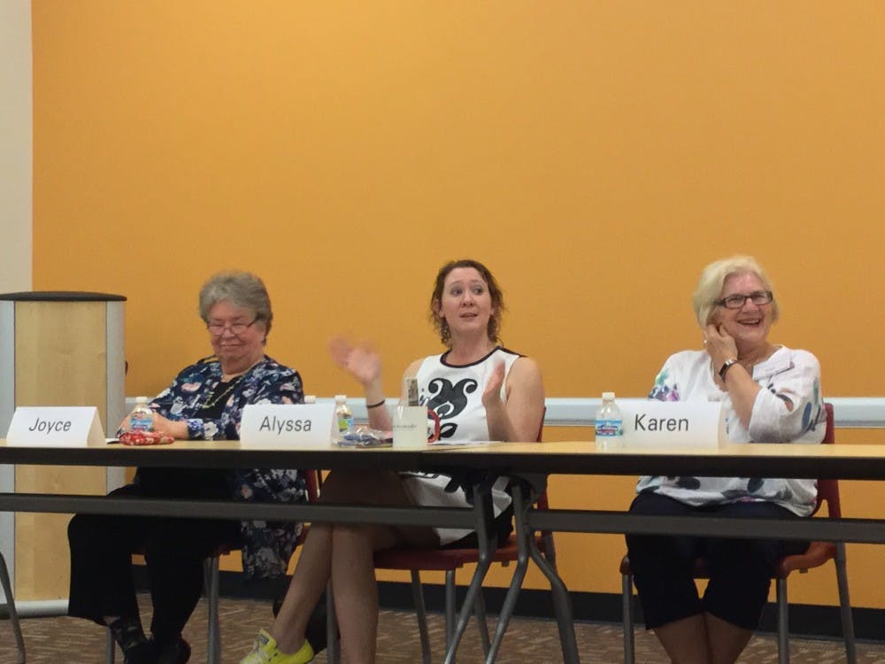 <p>Romance author Alyssa Alexander details her writing process as poet Joyce Benvenuto and author Karen Dean Benson laugh along at Wednesday's Local Authors Panel. <strong>Photo by Maxwell Evans</strong></p>