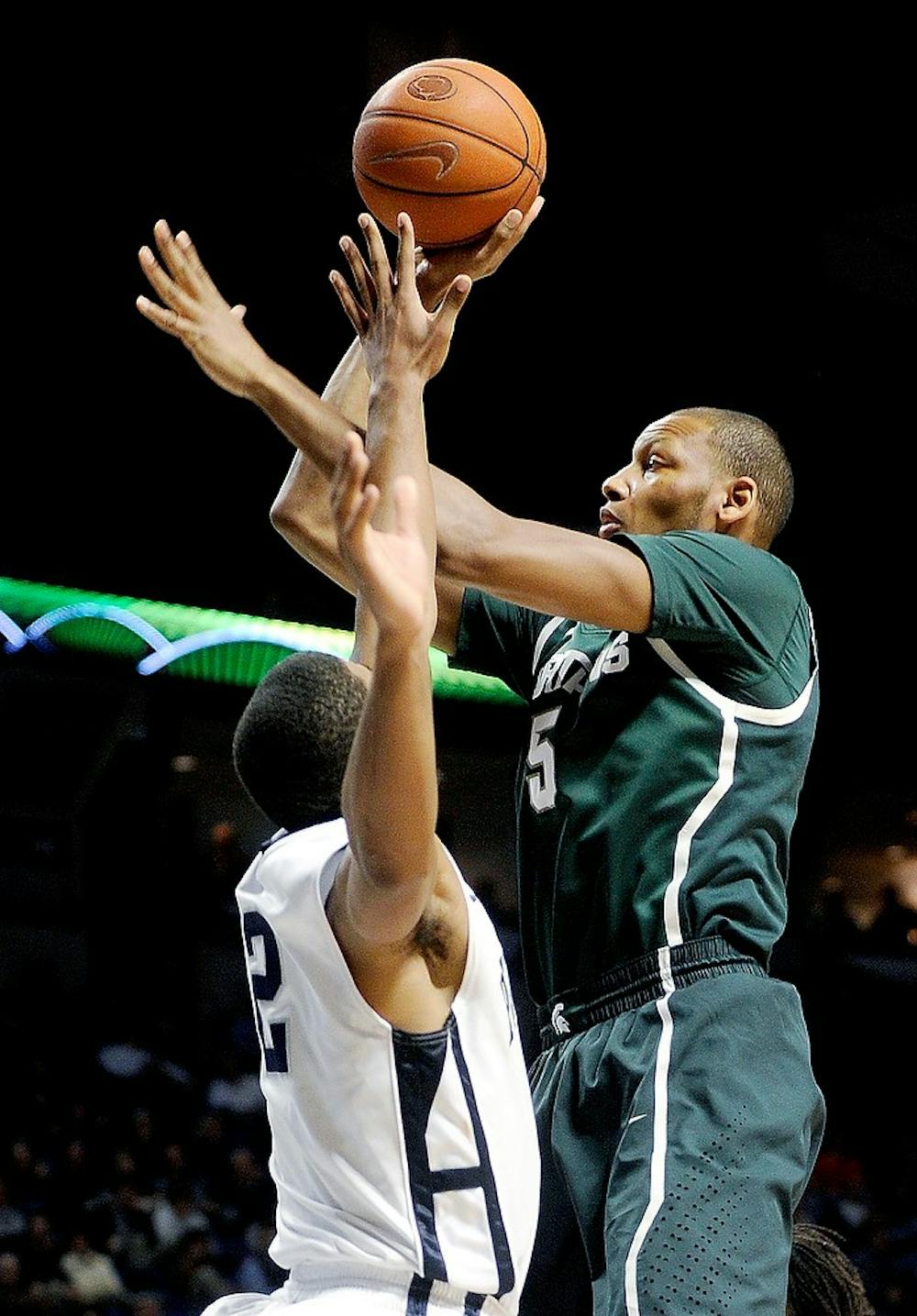 	<p>Junior center Adreian Payne shoots a basket over Penn State Nittany Lions D.J. Newbill during the second half of the game at the Bryce Jordan Center on Wednesday  in State College, Penn. The Spartans won, 81-72. Abby Drey/Centre Daily Times/MCT</p>