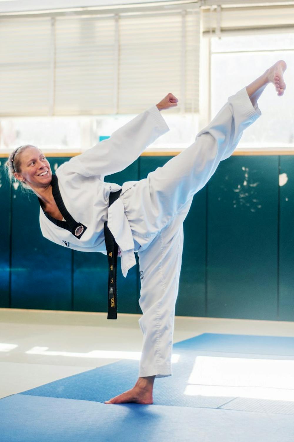 Kimberly Fritzsche, of Owosso, Mich. practices a special technique of Taekwondo at IM West with the MSU Taekwondo Club.  The club is part of both USA Taekwondo and the National Collegiate Taekwondo Association and is training for a national championship. Adam Toolin/The State News