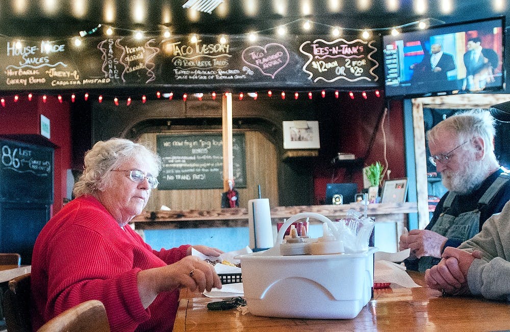 	<p>From left, Lansing residents Beverly Frank and husband Duane Frank eat Tuesday, Oct. 16, 2012, at Meat. Southern B.B.Q. &amp; Carnivore Cuisine, 1224 Turner Street. The restaurant specializes in authentic southern barbecue by slow-cooking their meats for hours.</p>