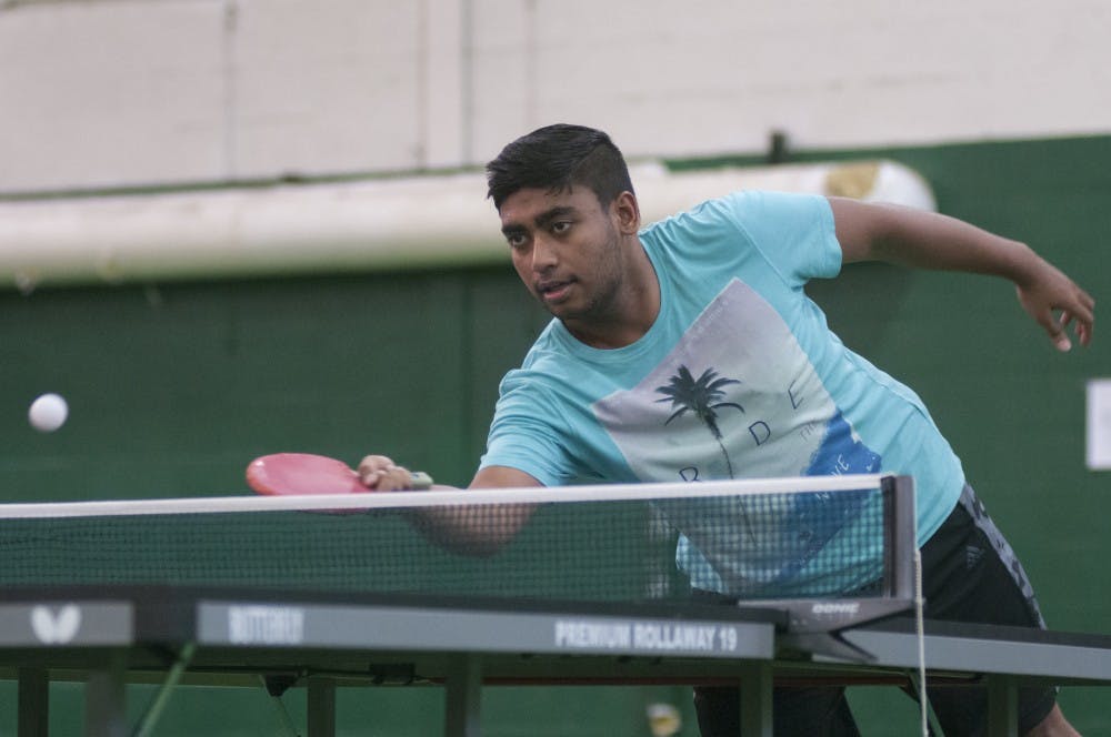 Computer science freshmen Rohit Sen warms up for a game of table tennis on Oct. 23, 2016 in IM Sports-West. Sen said he represented West Bengal in the WABTTA junior tournament in India.