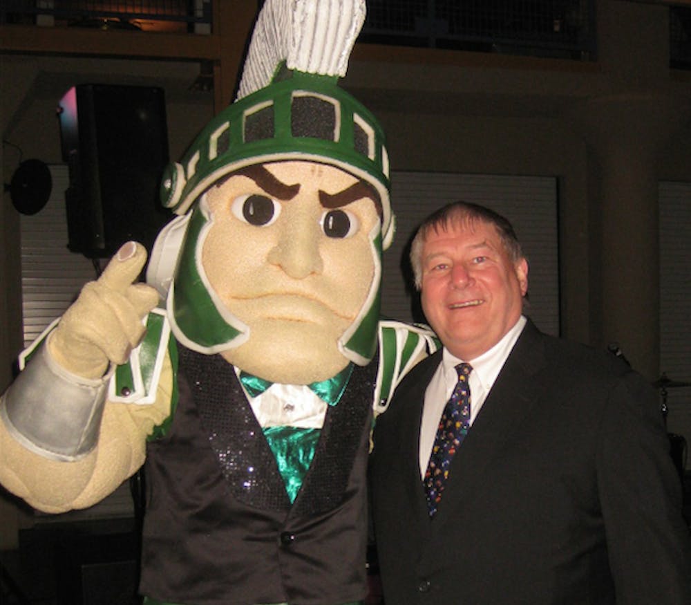 <p>Jim Higgins with Sparty at the Spartyball event in Chicago. Photo courtesy of Kevin Higgins</p>