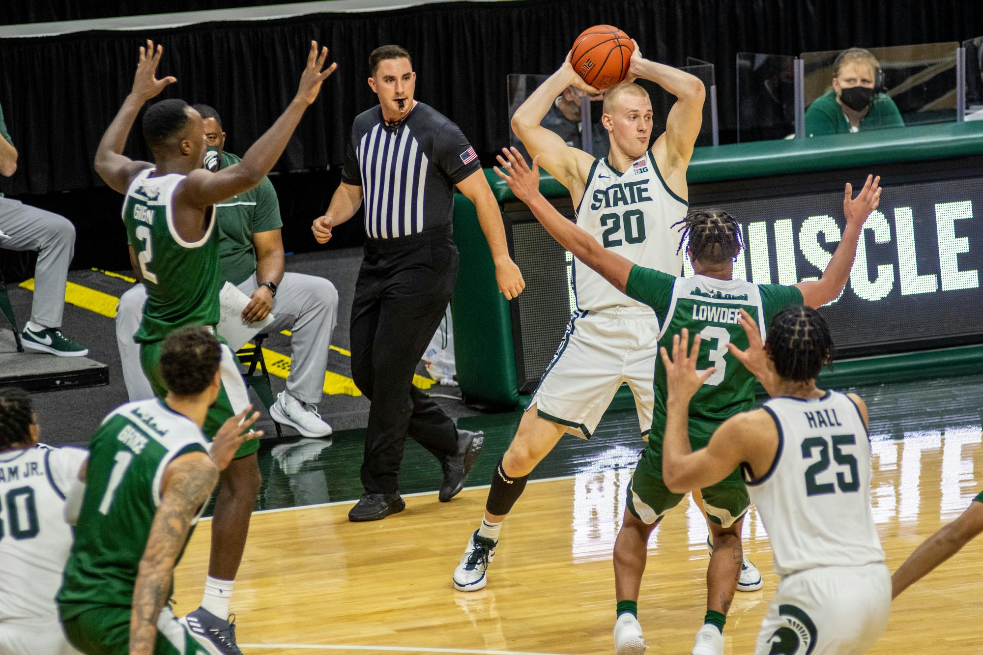 Red-shirt junior forward Joey Hauser(20) tries to pass the ball during the game against Eastern Michigan on Nov. 25, 2020 at the Breslin Center. The Spartans defeated the Eagles, 83-67.