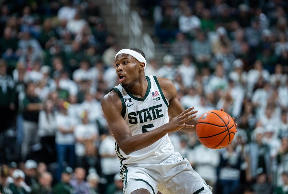 <p>Michigan State junior guard Tre Holloman (#5) dribbles the ball down the court at the Breslin Center on January 28th, 2025.</p>