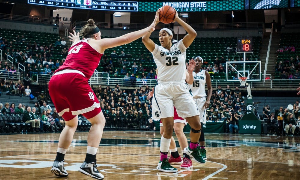 Graduate student forward Taya Reimer (32) looks to score as Indiana center Jenn Anderson (43) attempts to stop her during the women's basketball game against Indiana on Feb. 2 2017 at Breslin Center. The Spartans defeated the Hoosiers 69-60.