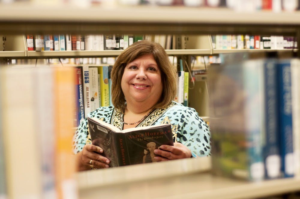 	<p>East Lansing Public Library Director Kristin Shelley poses for a portrait Sept. 12, 2013, at the library. Shelley organizes all things happening at the library and also is on the board that decides the book for One Book, One Community that every incoming <span class="caps">MSU</span> freshman must read. Margaux Forster/The State News</p>