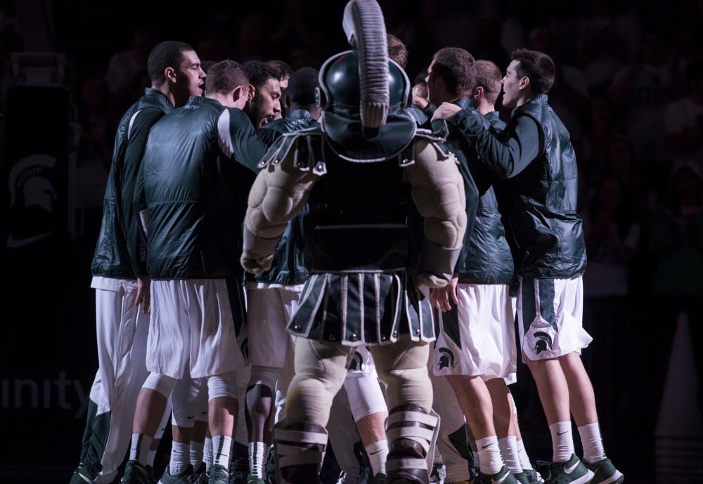 <p>The men's&nbsp;basketball team and Sparty huddle up on Nov. 9, 2015 prior to the game against Ferris State at Breslin Center. The Spartans defeated the Bulldogs, 93-57. </p>