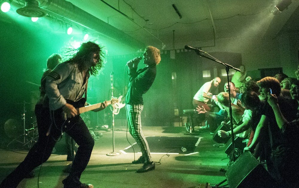 The Cincinnati based band Foxy Shazam performs in front of a packed crowd on Monday, Sept. 24, 2012 at the Loft. Foxy Shazam is known for their energetic music and wild stage presence. James Ristau/The State News