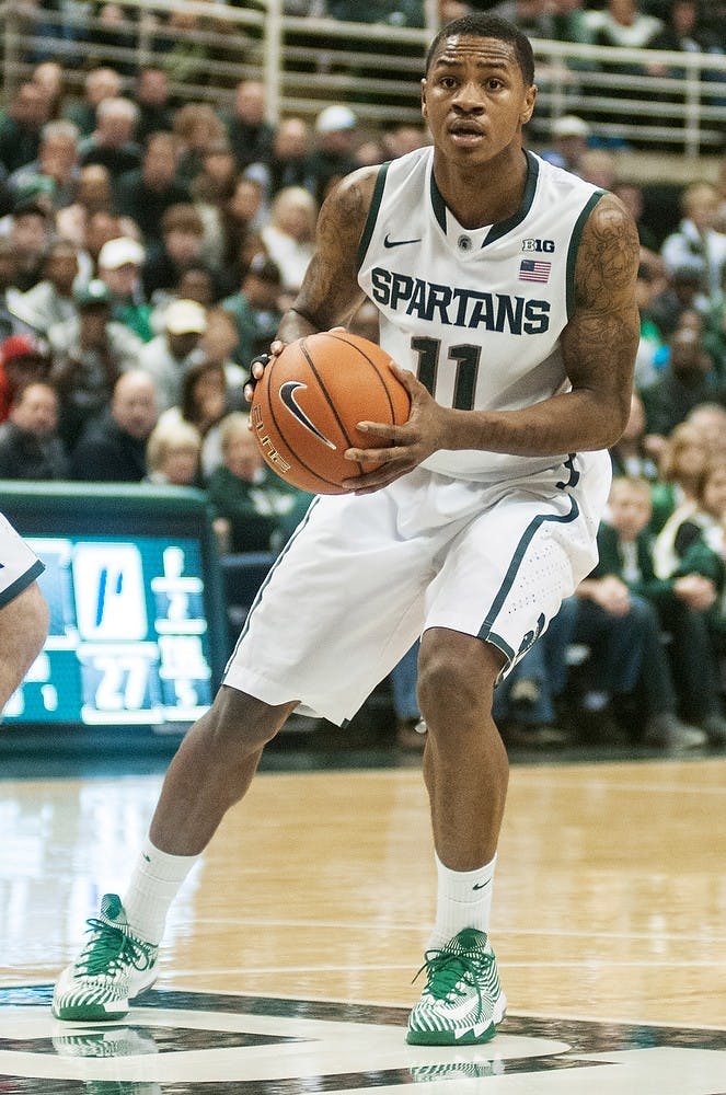 	<p>Senior guard Keith Appling looks to pass during the game against Portland on Nov. 18, 2013, at Breslin Center. The Spartans beat Portland, 82-67. Danyelle Morrow/The State News</p>