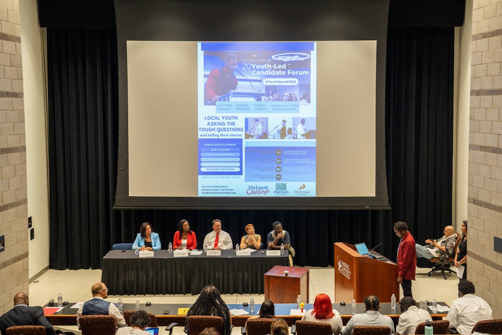 Local candidates for state office (L-R) Rep. Angela Witwer (D-Delta Township), Rep. Sarah Anthony (D-Lansing), Jeremy Whittum, Emily Dievendorf and John Magoola listen as a participant asks them a question at Lansing Community College on Sept. 19, 2022.