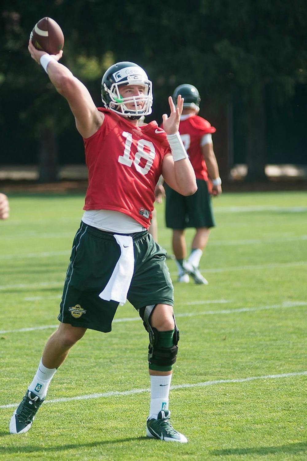 <p>Then junior quarterback Connor Cook participates in practice drills Aug. 2, 2014, at the practice field outside Duffy Daugherty Football Building. Danyelle Morrow/The State News</p>