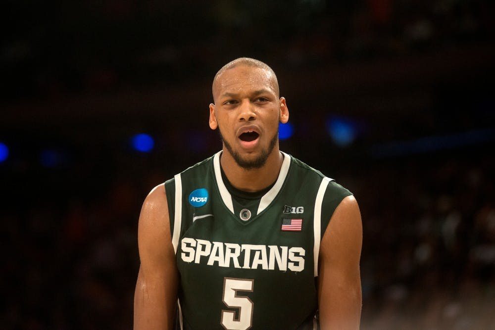 <p>Then-senior forward Adreian Payne reacts to a foul called against him March 28, 2014, during the game against Virginia at Madison Square Garden in New York City during the NCAA tournament. The Spartans won, 61-59. Julia Nagy/The State News</p>