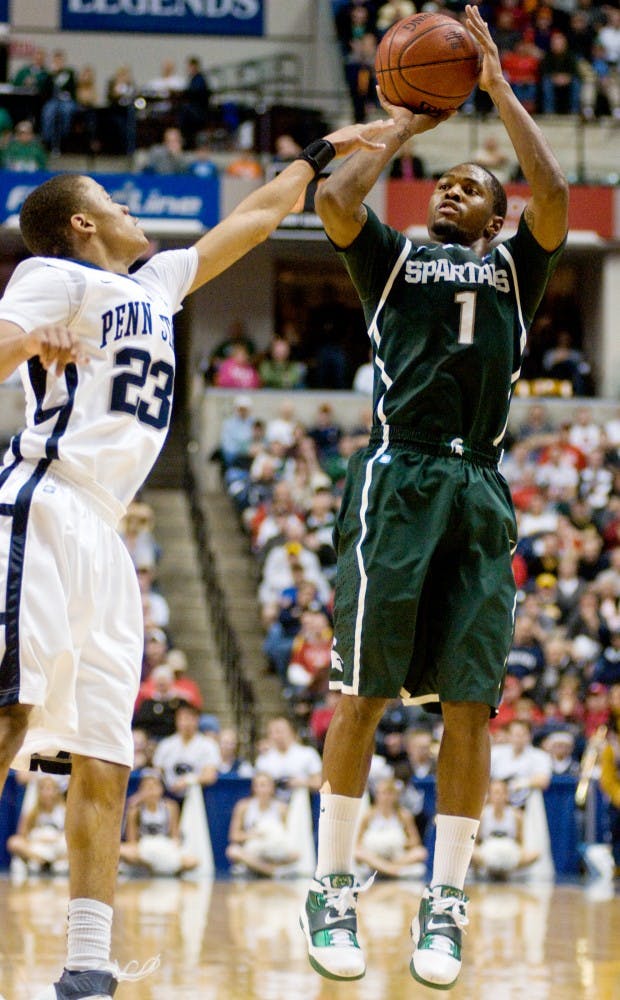 Senior guard Kalin Lucas gets off a shot over Penn State guard Tim Frazier Saturday at Conseco Fieldhouse in Indianapolis, Ind. The Spartans were defeated by the Nittany Lions 61-48. Matt Radick/The State News