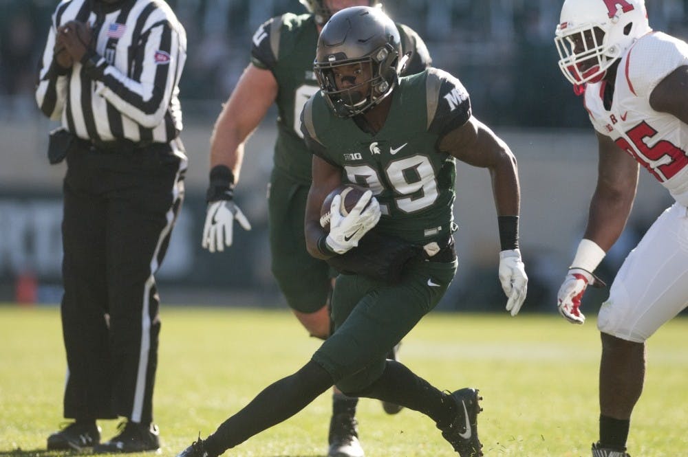 <p>&nbsp;Freshman wide receiver Donnie Corley (29) runs the ball down the field during the game against Rutgers on Nov. 12, 2016 at Spartan Stadium. The Spartans defeated the Scarlet Knights, 49-0. <strong>Photo by Victor DiRita.</strong></p>