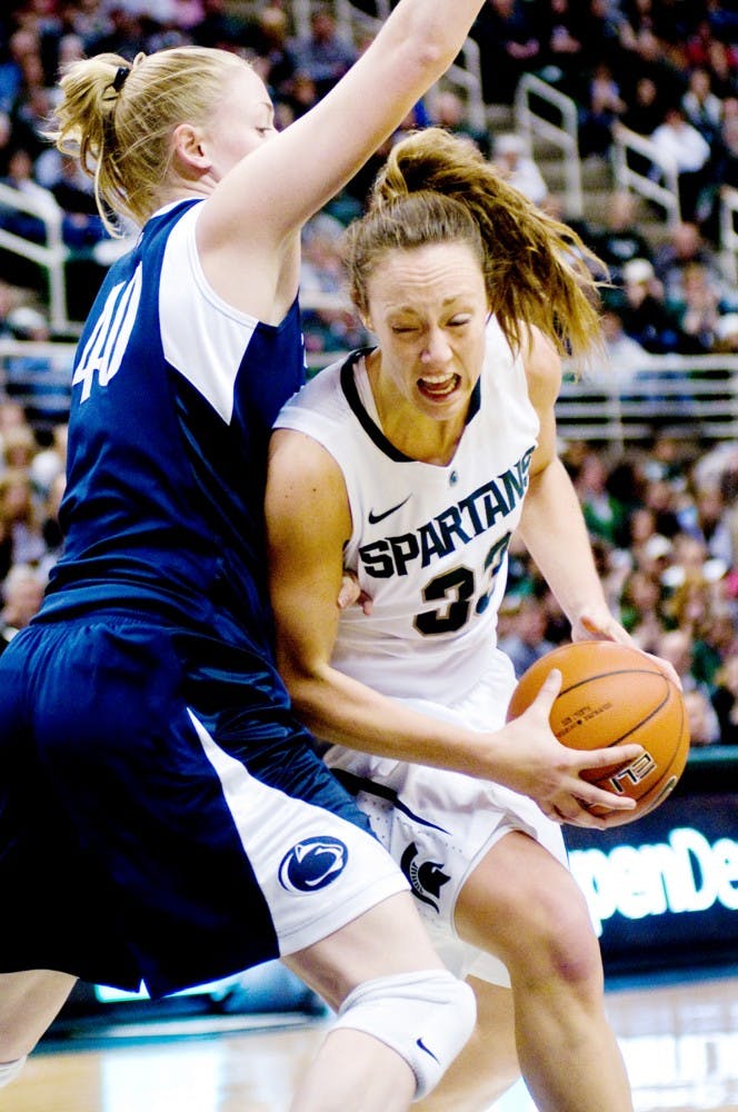 Senior guard Taylor Alton attempts to score on Penn State junior forward Marisa Wolfe Sunday afternoon at Breslin Center. Alton was 2-4 behind the three-point line in the 83-77 MSU victory over Penn State. Jaclyn McNeal/The State News