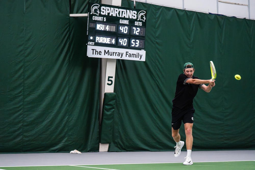 <p>Daniel Rakhmatullayev, a sophomore on the Michigan State men’s tennis team, competes in a singles match against Purdue junior Juan David Velasquez at the MSU Tennis Center in Lansing, Mich., Sunday, April 19, 2026.</p>