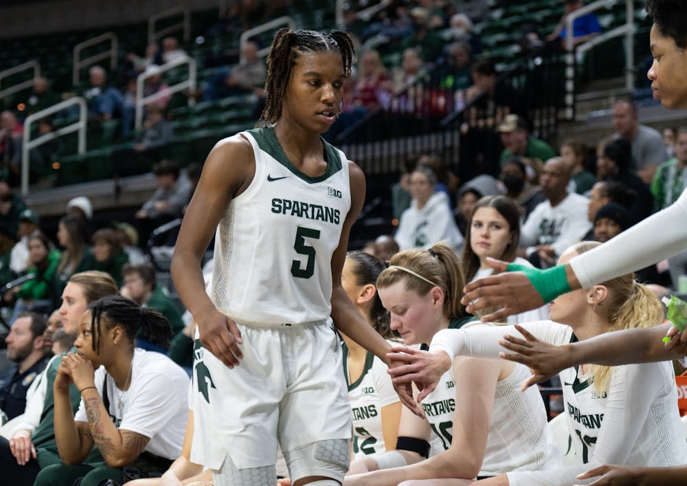 <p>MSU guard Kamaria "K-Mac" McDaniel receives high fives from the MSU bench after a substitution at the Breslin Center in East Lansing on Wednesday, Feb. 22, 2023. McDaniel averages 13.7 points a game for the Spartans.</p>