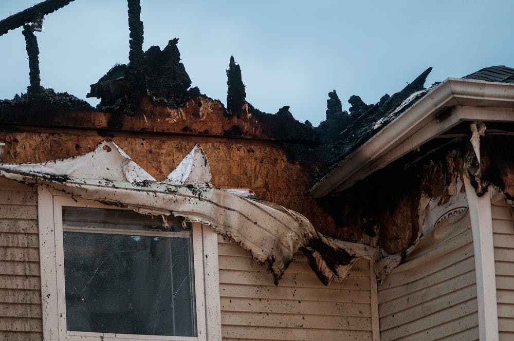 <p>A building is left ruined Oct. 5, 2014, after a fire at The Landings at Chandler Crossings. Erin Hampton/The State News</p>