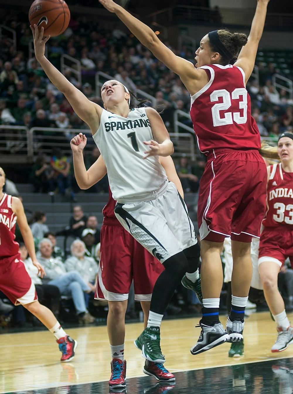 <p>Sophomore guard Tori Jankoska attempts to score Jan. 28, 2015, after getting past Indiana guard Alexis Gassion during the game against Indiana at Breslin Center. The Spartans defeated the Hoosiers, 72-57. Emily Nagle/The State News</p>