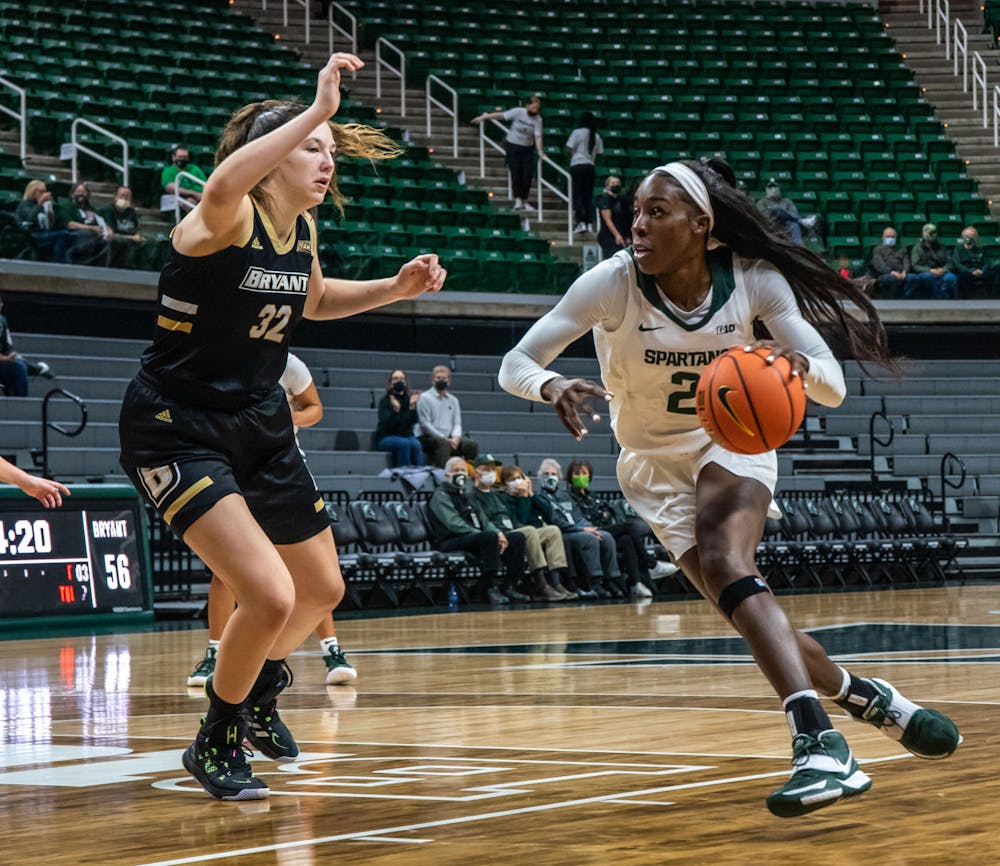 Graduate student forward Tamara Farquhar (2) runs the ball back to score against Bryant in the third quarter. The Spartans crushed the Bulldogs, 100-60, which led coach Suzy Merchant to her 300th win with Michigan State on Nov. 19, 2021.