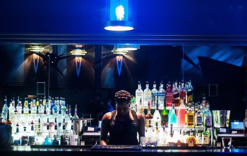 	<p>Secrets Nightclub employee Alisha &#8220;Happi&#8221; Randle prepares the bar Feb. 7, 2013. The club, 224 Washington Square Street, was formally known as Club X-Cel, but changed names under new ownership.</p>