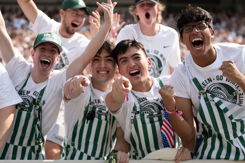 MSU students celebrate a touchdown during the game against Youngstown State Sep. 11, 2021. The Spartans won the game against Youngstown State 42-14 at Spartan Stadium.